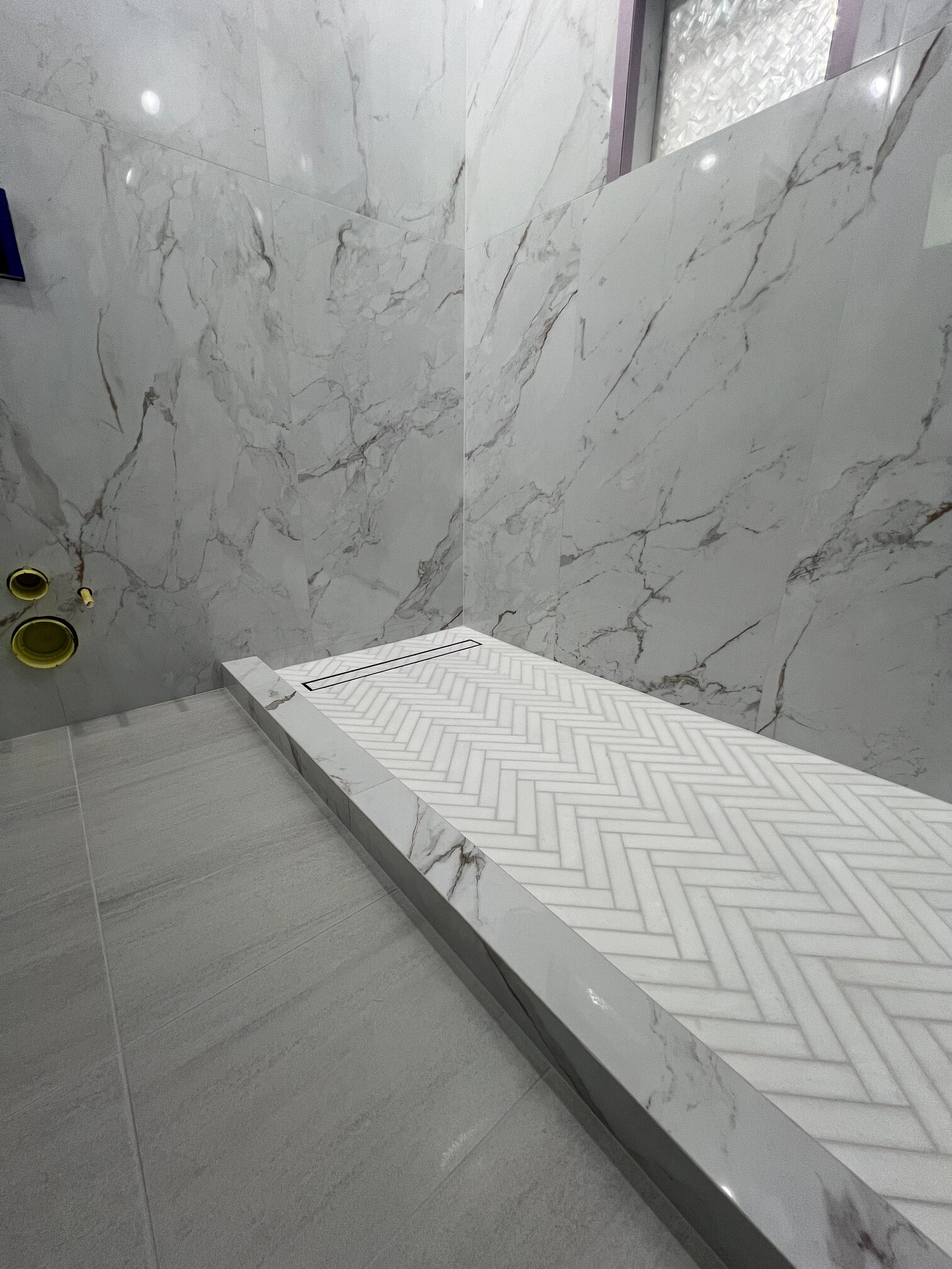 Bathroom large format porcelain tile wall herringbone tile shower floor